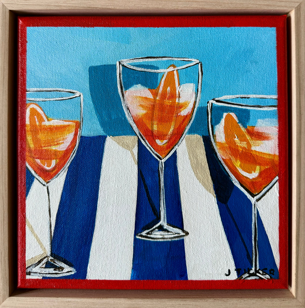 Three Aperols on blue